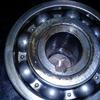 This rear bearing is bad, it is rough and you can see the water droplets in the oil.